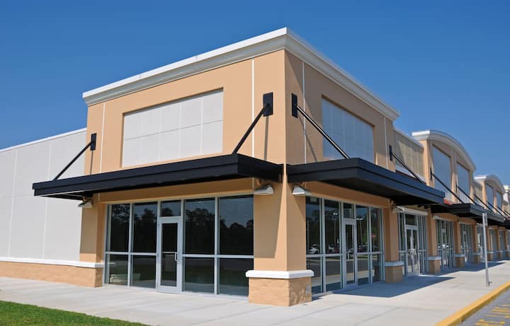 Bright red commercial awning in Naples, FL.