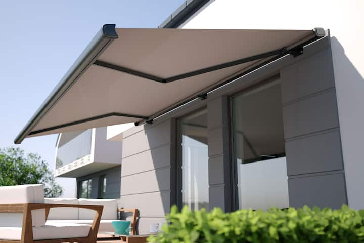 Beautiful residential awning enhances Naples, FL residence.